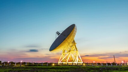 Astronomical radio telescope and beautiful sky clouds at sunset. 4K time lapse footage.