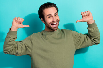 Photo of hooray brunet young guy index himself wear green shirt isolated on teal color background