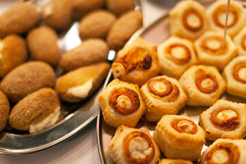 Selection of salty appetizers on plates full frame close up
