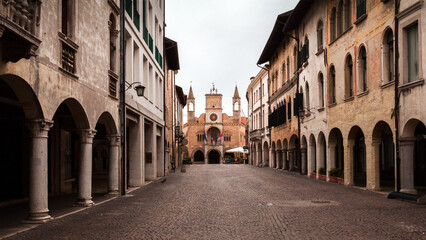 Fototapeta na wymiar Communal Palace of Pordenone on the end of the beautiful medieval Corso Vittorio Emanuelle II street