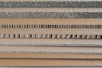 A stack of corrugated cardboard of various thicknesses