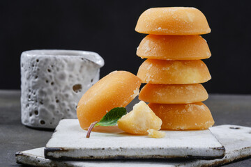 Several palm sugar cakes made from palm tree sap. Shallow depth of field