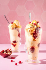 Vanilla ice cream milkshake garnished with fresh pistachio and pomegranate seeds