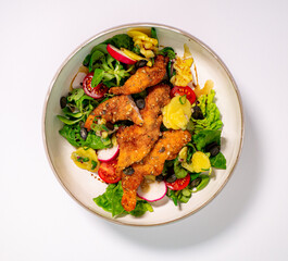 Chicken Salad with vegetables on a plate and withe background