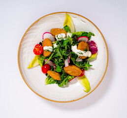 Chicken Salad with vegetables on a plate and withe background