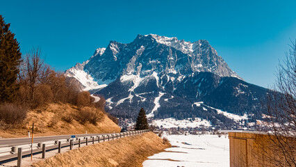 Beautiful winter landscape view with the famous Zugspitze summit seen from Lermoos, Tyrol, Austria
