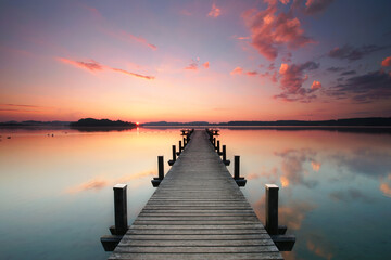 Naklejka na ściany i meble magical sunrise at wooden pier