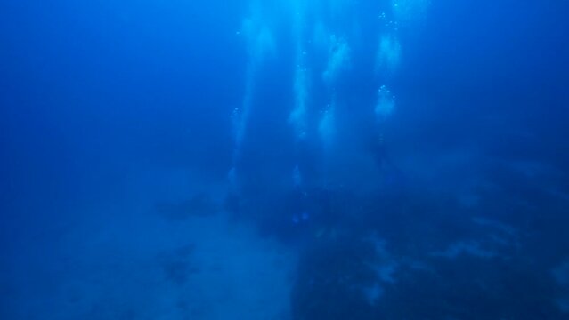 Under the sea, the image of the bubbles created by the divers.