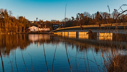 Beautiful winter view with a church and reflections near Zeholfing, Isar, Bavaria, Germany