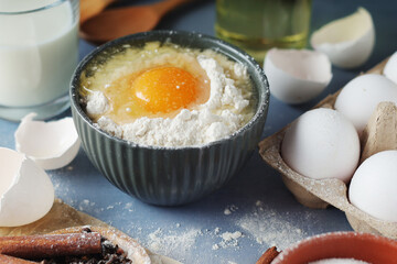 Food ingredients for baking: flour, eggs, milk, sugar	