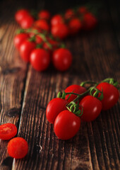 Cherry tomatoes on the table in low key