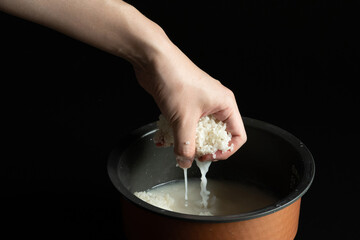 Fototapeta premium hand holding rice