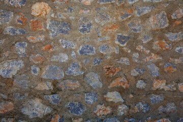 The stonewall background with an overused cement ratio.