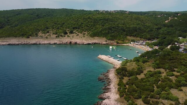 Aerial view of Risika Beach and marina on Krk island in the Mediterranean Sea