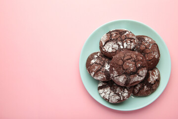 Dark Chocolate chip cookies on plate on pink background. Delicious Cookie Macro