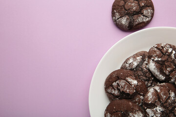 Dark Chocolate chip cookies on plate on purple background. Delicious Cookie Macro