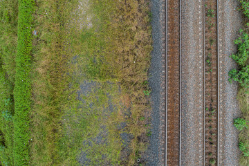 Top down view of railway line and grass beside train track