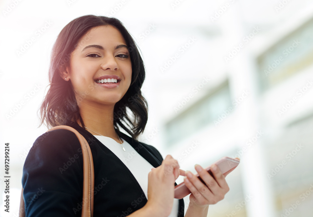 Poster i always make sure ive got my phone in my hand. cropped portrait of an attractive young businesswoma