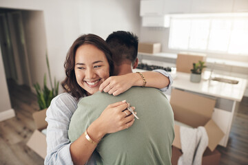 This is a dream come true for us. Shot of a couple embracing each other while moving into their new home.