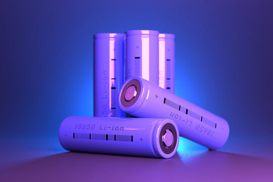 5 purple cylindrical li-ion batteries type 18650 on the table. Rechargeable lithium-ion batteries for electrical devices