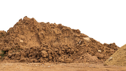 Brown mound isolates dug up and left on the ground to prepare for landfill.