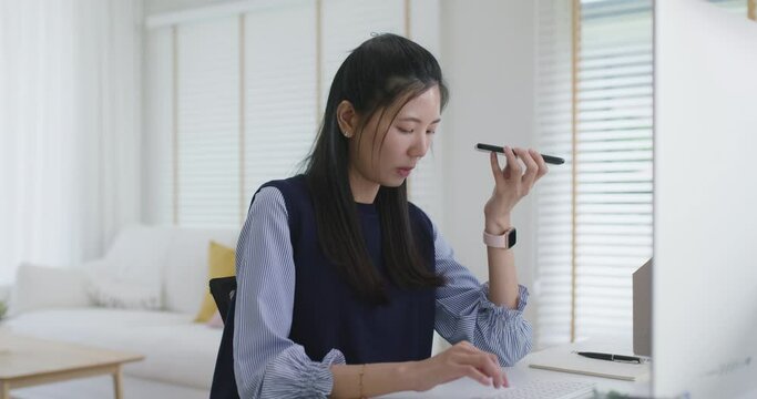 Asia people young casual woman remote work at desk home mobile phone call voice chat talk study learn MBA online class. SEO sale plan report on desktop PC reskill upskill career job smart workforce.