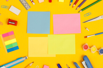 Top view notebooks and accessories studying in the library at school yellow background idea education