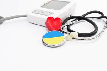 Heart and stethoscope isolated on white background with colors of ukrainian flag. Concept for...