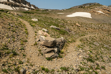 Trail Bends Around Rock pile In Grand Teton