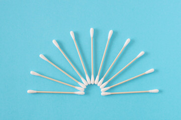 white bamboo cotton buds on blue background