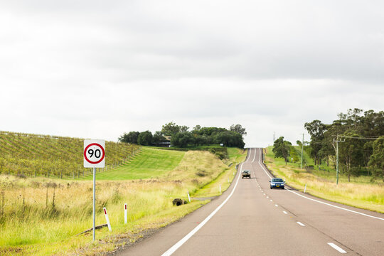 90 speed sign on road beside vineyards in Hunter Valley