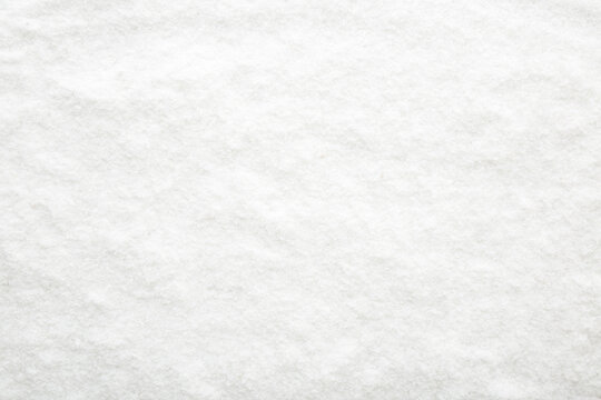 White dry sea salt background. Top view. Empty place for text. Top down view.