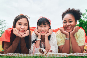 Three Young Women Lesbian with Rainbow Flage, Diversity Concept, Pride of LGBTQ.