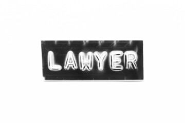 Black color banner that have embossed letter with word lawyer on white paper background