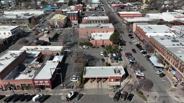 Cinematic 4K aerial drone shot of old, historic buildings downtown in the city of Ellensburg, Kittitas County in Western Washington