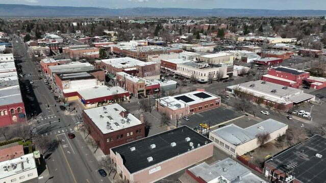Cinematic 4K aerial drone dolly in shot of old buildings in the city of Ellensburg downtown, Kittitas County in Western Washington