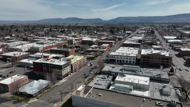 Cinematic 4K aerial drone trucking shot of the city of Ellensburg, Kittitas County in Western Washington