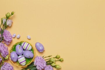 Easter eggs in a basket bouquet of purple flowers on a yellow background with place for text.