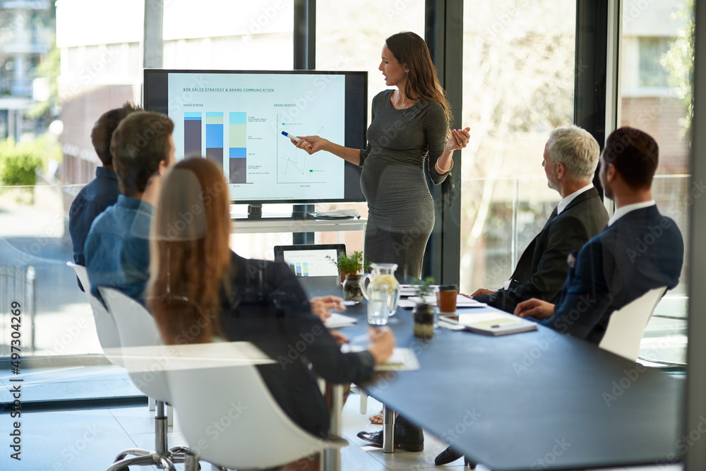 Poster taking stock and setting new targets. shot of a corporate businessperson giving a presentation in th