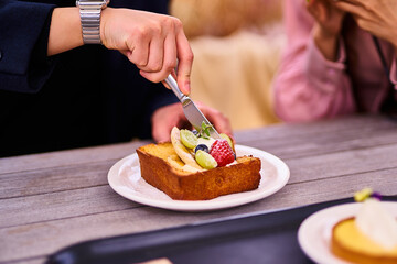 person cutting a cake