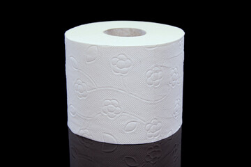 Toilet paper roll on a black background. Presentation of toilet paper roll, isolated on black...