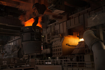 A Bessemer converter in a steel mill full of liquid steel