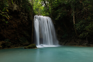 Fototapeta na wymiar Erawan Waterfall,beautiful waterfall deep forest in Thailand