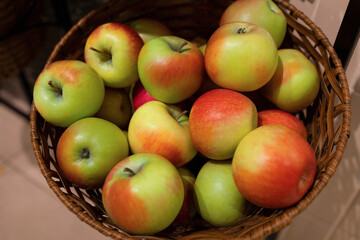 Apples in the basket at supermarket. Concept of organic and healthy food consumption