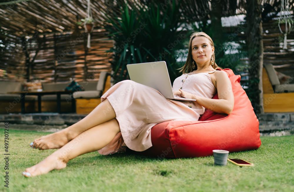 Poster contemplative caucaisan woman with modern laptop computer thoughtful looking away and thinking about