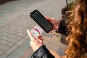 Online shopping, woman preparing to shop with phone and credit card in hand, ready to enter their information and about to confirm the order