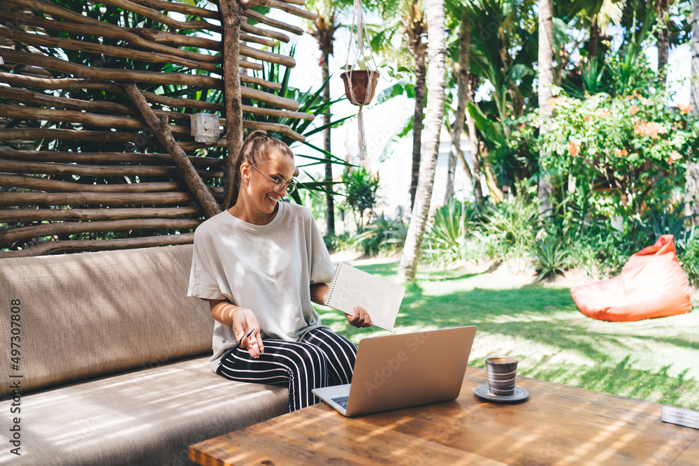 Poster happy caucasian woman have positive video call while working remotely on laptop computer with front 