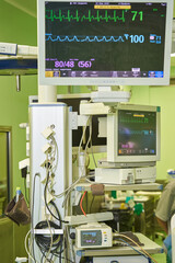 operating room equipment showing the heart rate. a heart monitor with additional parameters for measuring oxygen tension in the blood, pulse, pressure, temperature, ecg and alarm