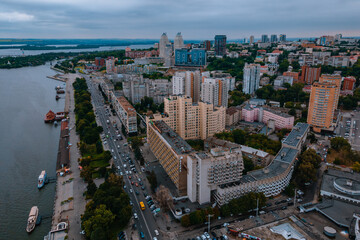 Fototapeta premium Dnipro, Ukraine. View of the central part of the city, the embankment of the Dnieper. Top view from a great height. Panoramic view of the city. Right bank of the city