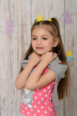 A child iin the interior with a festive decor. Easter day.